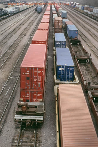 containers in well cars sit in Proviso Yard.